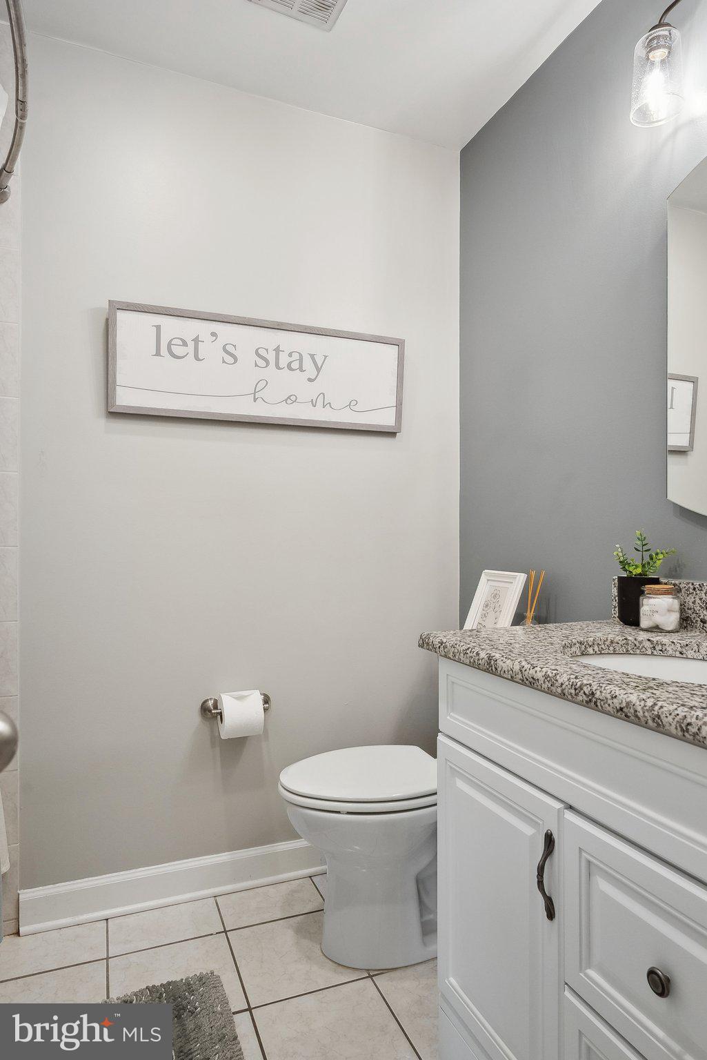 7940 Donegal Lane Springfield, VA 22153 - Photo 26 of 36 a bathroom with a granite countertop toilet and a sink