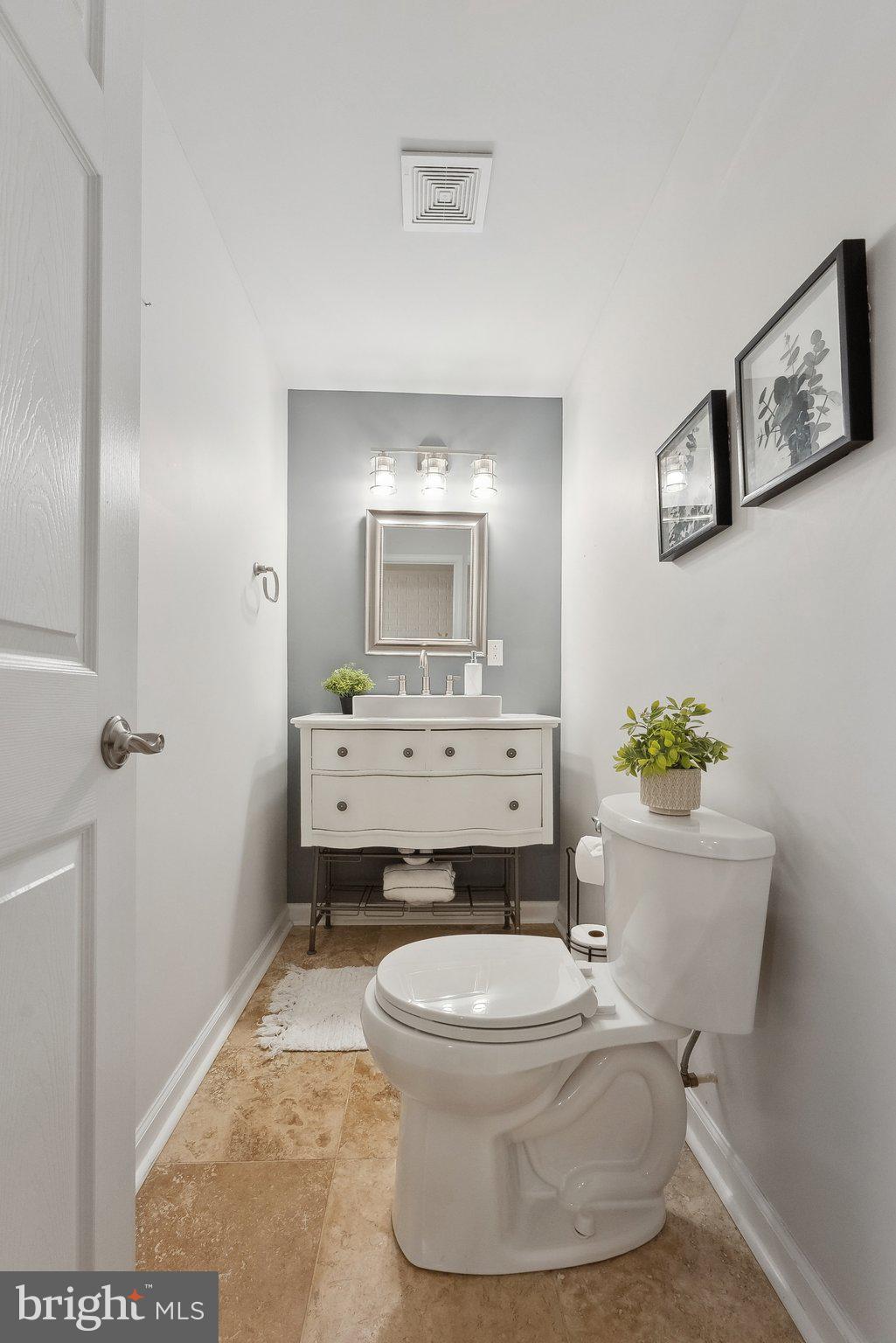 7940 Donegal Lane Springfield, VA 22153 - Photo 34 of 36 a bathroom with a toilet sink and mirror