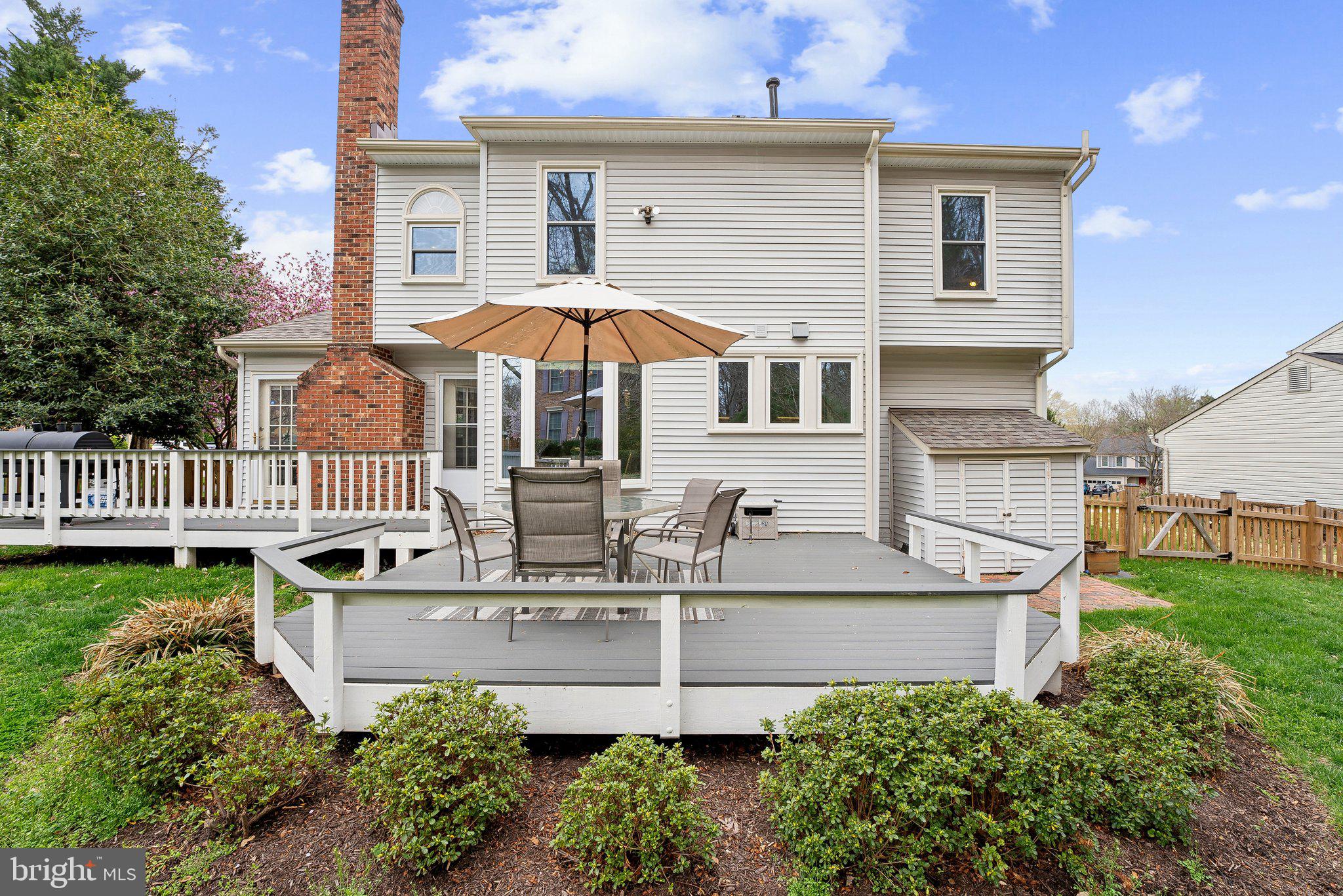7940 Donegal Lane Springfield, VA 22153 - Photo 35 of 36 a view of a house with a yard patio and a garden