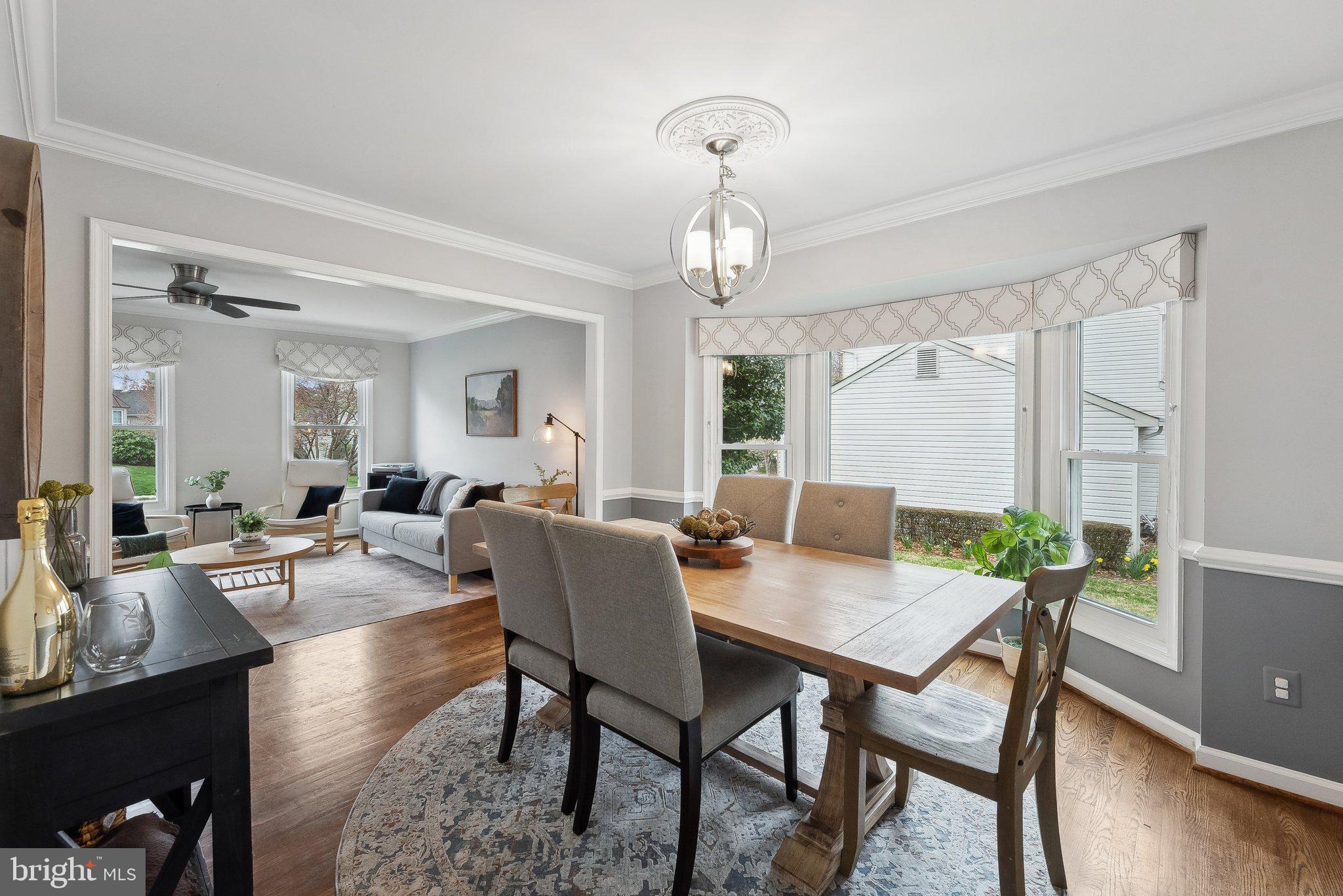 7940 Donegal Lane Springfield, VA 22153 - Photo 7 of 36 a view of a dining room with furniture and wooden floor