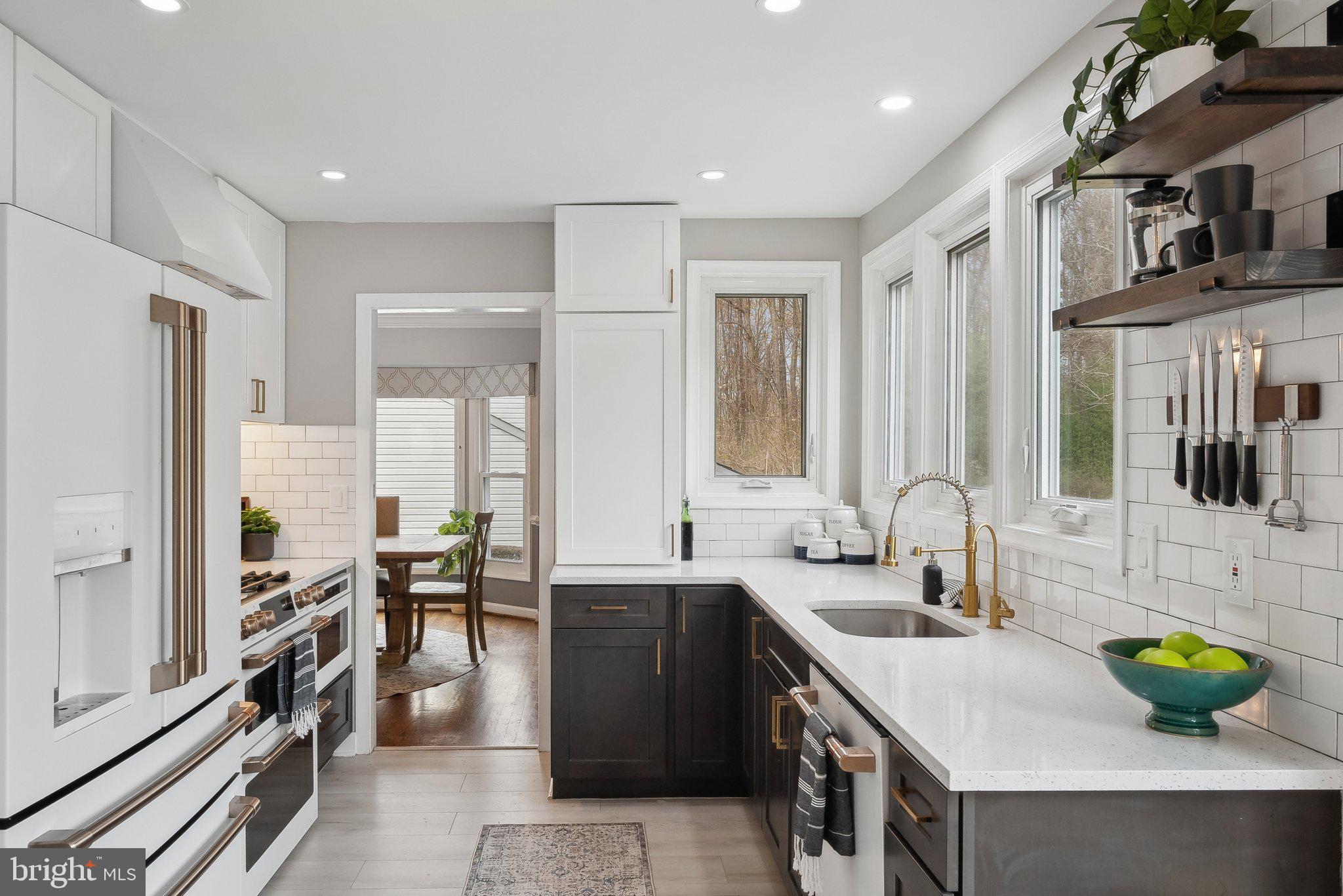 7940 Donegal Lane Springfield, VA 22153 - Photo 10 of 36 a kitchen with lots of counter top space and windows