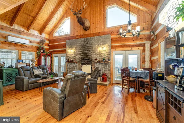 a view of living room with furniture and floor to ceiling windows