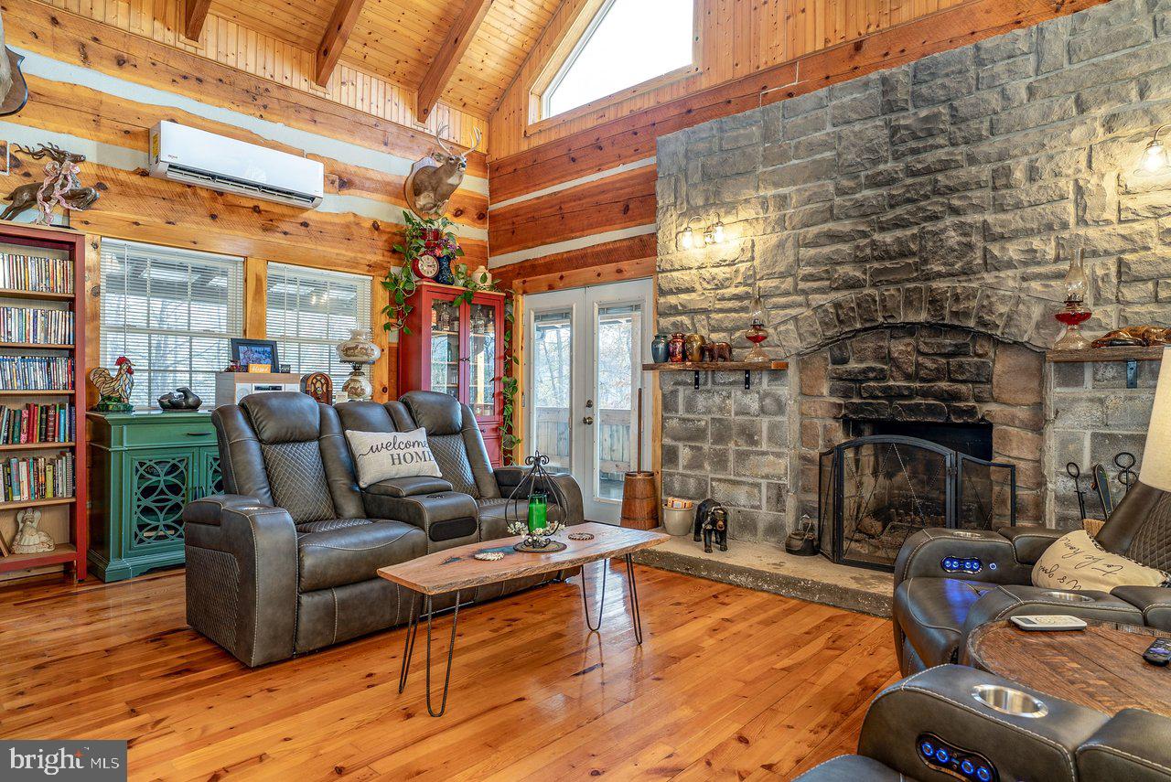 147 Bear Rdg Lane Milam, WV 26838 - Photo 16 of 72 a living room with patio furniture and a fireplace