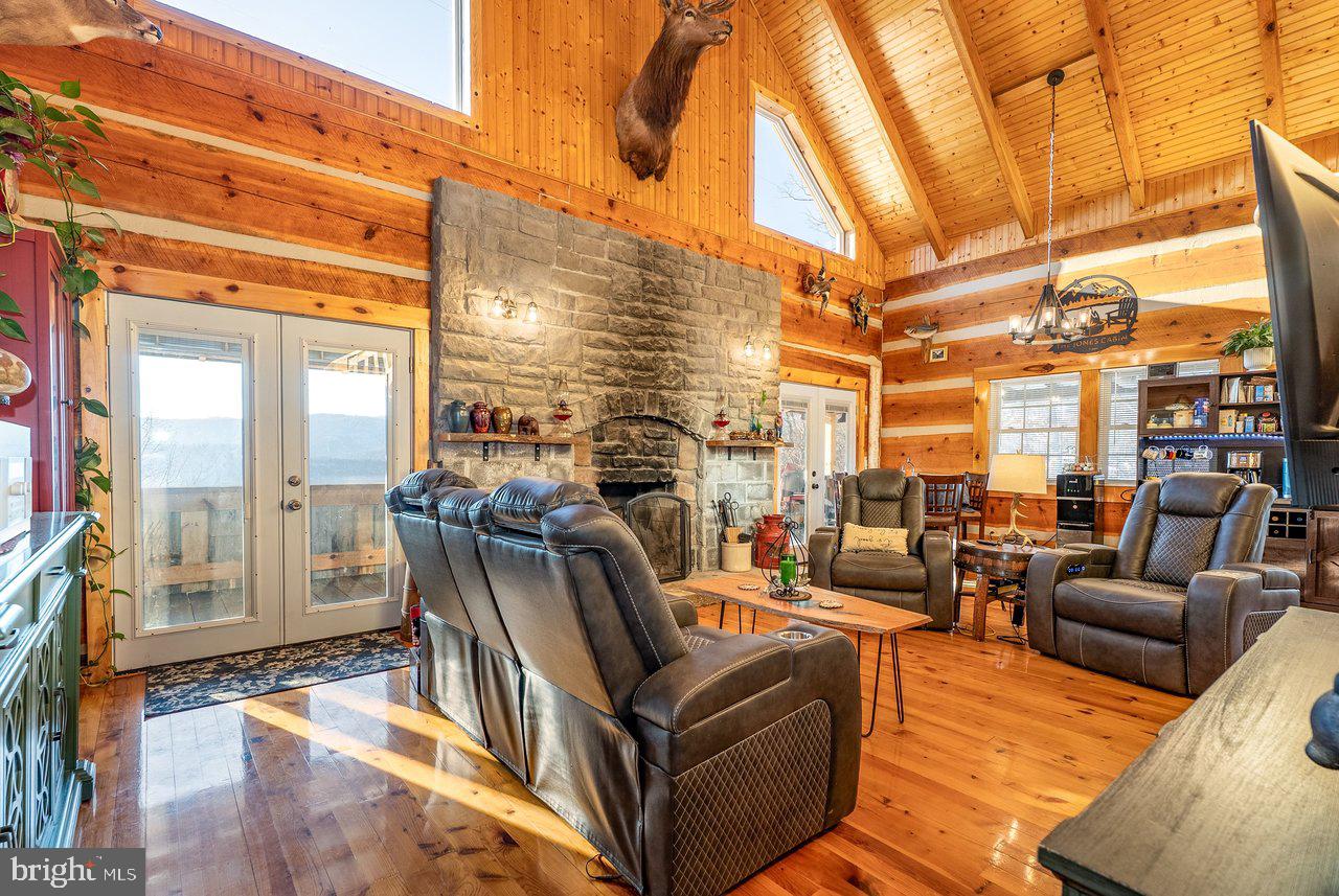 147 Bear Rdg Lane Milam, WV 26838 - Photo 22 of 72 a view of living room with furniture and floor to ceiling windows
