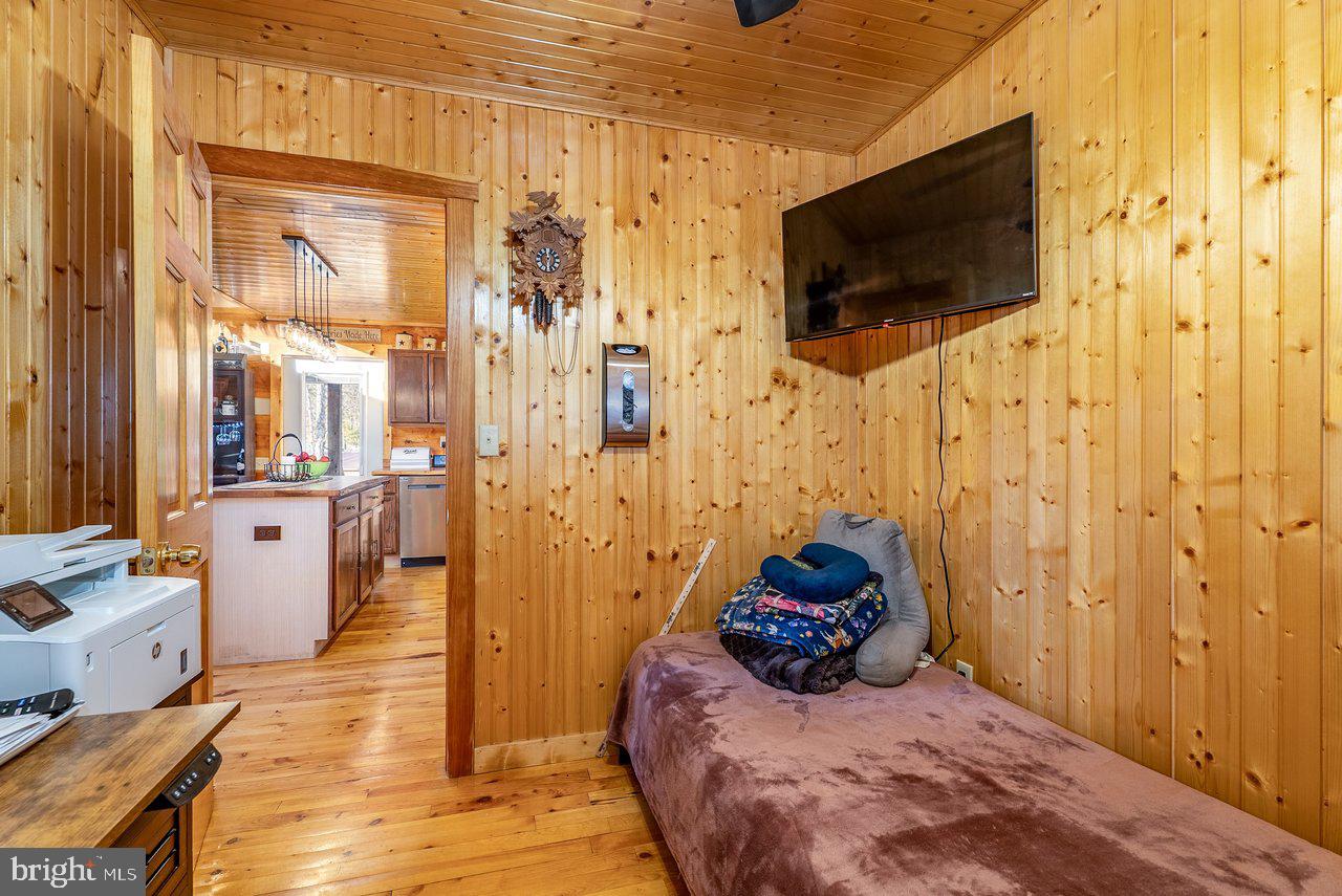147 Bear Rdg Lane Milam, WV 26838 - Photo 26 of 72 a bedroom with a bed and a flat screen tv