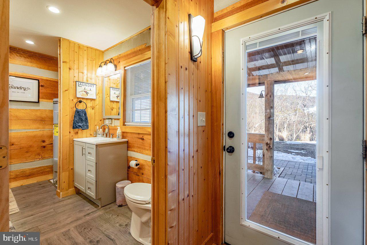 147 Bear Rdg Lane Milam, WV 26838 - Photo 30 of 72 a bathroom with a granite countertop sink toilet and shower