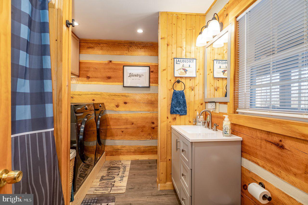 147 Bear Rdg Lane Milam, WV 26838 - Photo 31 of 72 a bathroom with a sink a mirror and a shower