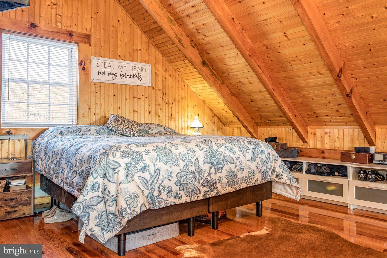 147 Bear Rdg Lane Milam, WV 26838 - Photo 35 of 72 a bed sitting in a bedroom next to a window