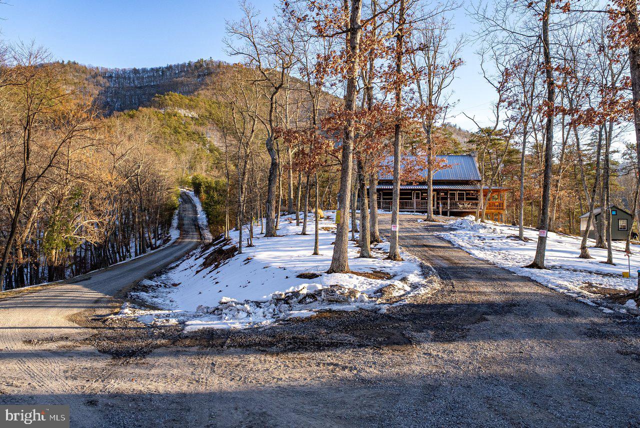 147 Bear Rdg Lane Milam, WV 26838 - Photo 43 of 72 a view of a house with snow on the road
