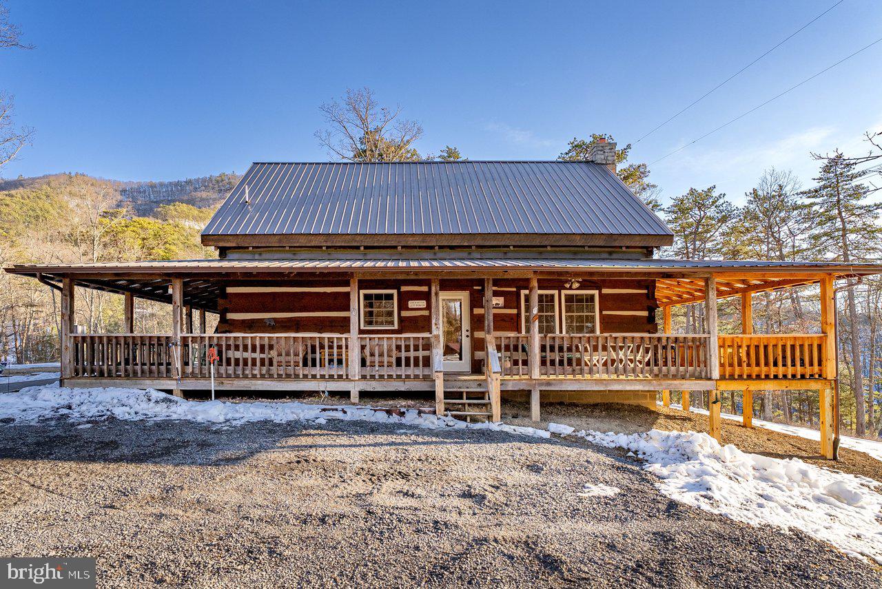 147 Bear Rdg Lane Milam, WV 26838 - Photo 45 of 72 a view of a house with a yard and wooden fence