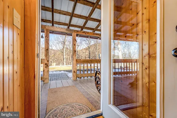 a kitchen view with stainless steel appliances granite countertop a refrigerator and a stove