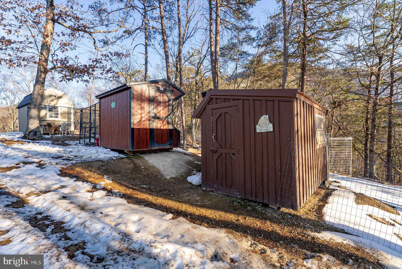 147 Bear Rdg Lane Milam, WV 26838 - Photo 65 of 72 a view of a house with a large tree and wooden fence