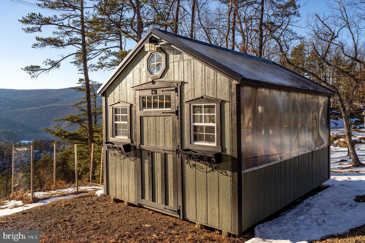 147 Bear Rdg Lane Milam, WV 26838 - Photo 71 of 72 a front view of a house with parking area