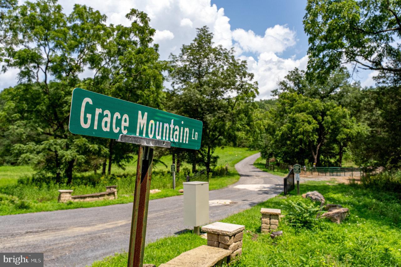 147 Bear Rdg Lane Milam, WV 26838 - Photo 72 of 72 a street sign on a sidewalk next to a road