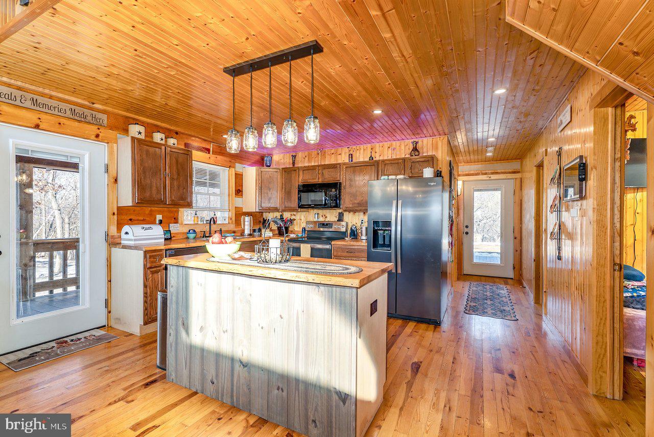 147 Bear Rdg Lane Milam, WV 26838 - Photo 8 of 72 a kitchen view with stainless steel appliances granite countertop a refrigerator and a stove
