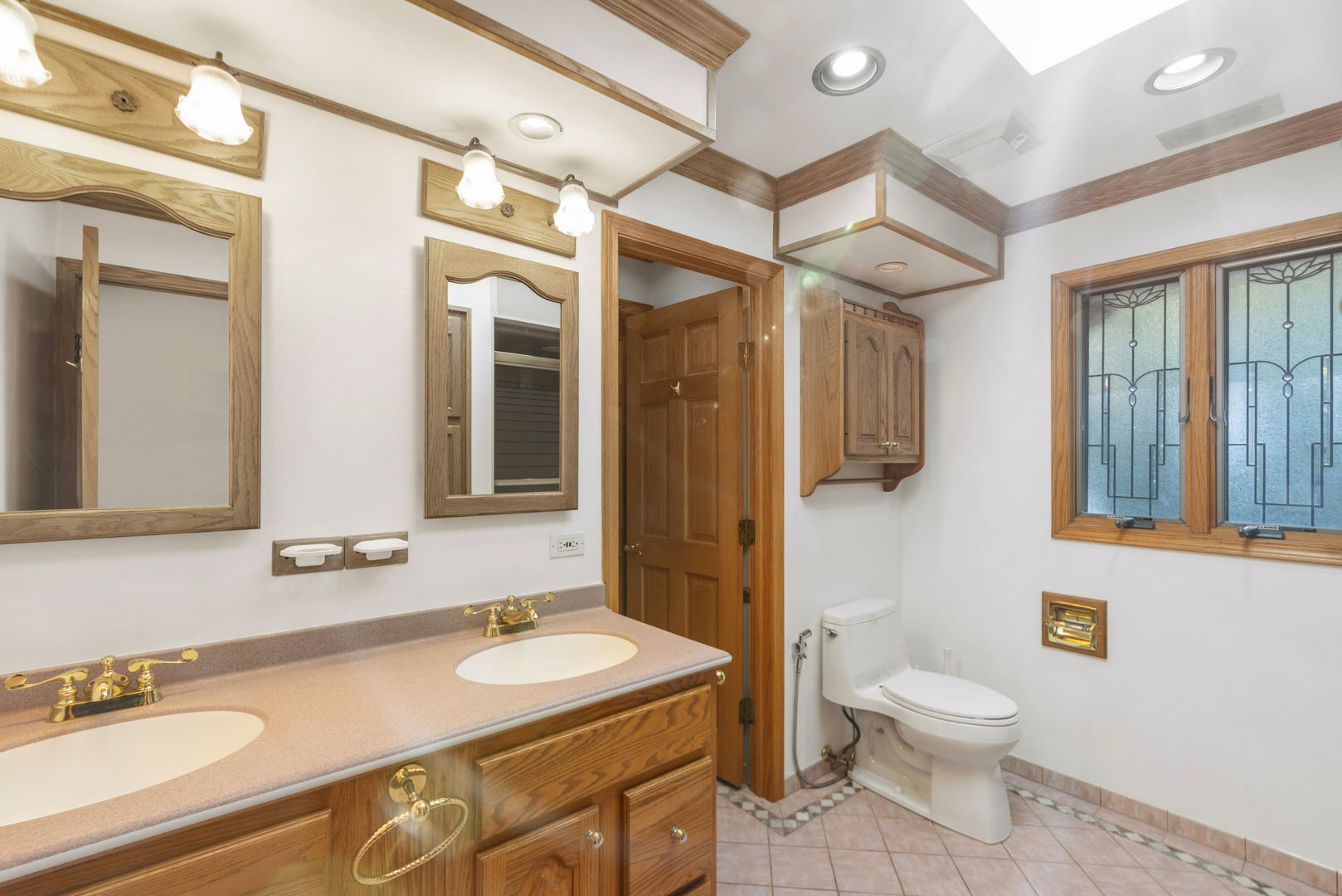 28 Cambridge Drive Oak Brook, IL 60523 - Photo 19 of 28 a bathroom with a granite countertop sink mirror vanity and toilet