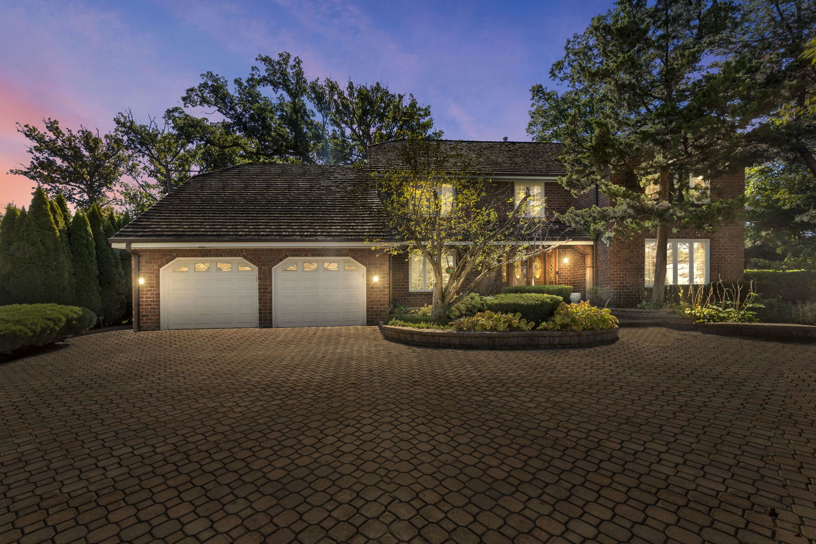 28 Cambridge Drive Oak Brook, IL 60523 - Photo 2 of 28 a view of a house with a yard and garage