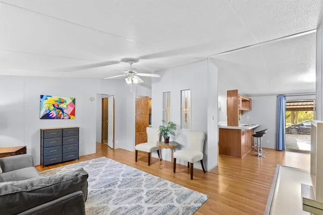 a view of workspace with furniture and wooden floor