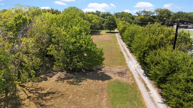 a view of a lake with a yard