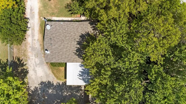 a view of outdoor space with swimming pool and trees in the background