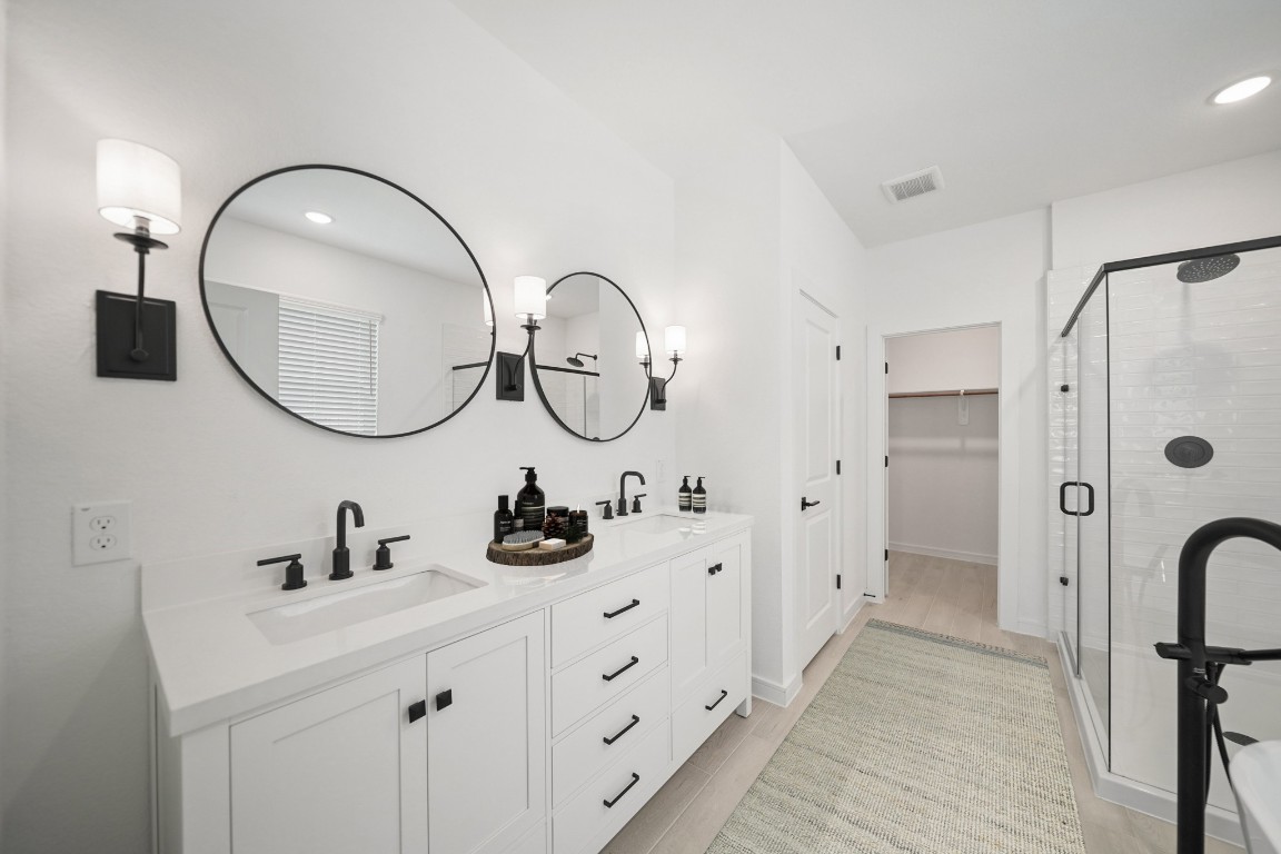 2826 Clapbread Lane Rosenberg, TX 77471 - Photo 12 of 41 a bathroom with a double vanity sink double and a mirror
