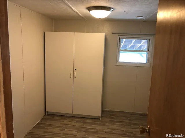 a bathroom with a toilet and a mirror