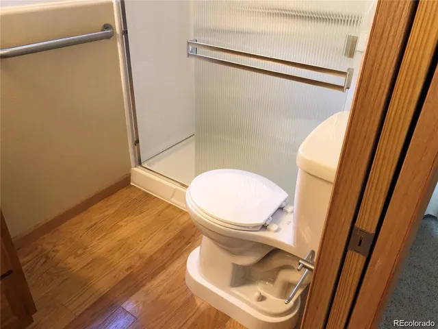 a bathroom with a glass shower door