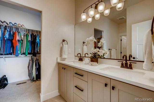 324 Spring Beauty Drive Berthoud, CO 80513 - Photo 16 of 25 a bathroom with a sink and a mirror