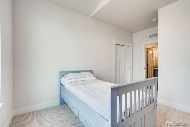 324 Spring Beauty Drive Berthoud, CO 80513 - Photo 19 of 25 a bedroom with a bed and a window