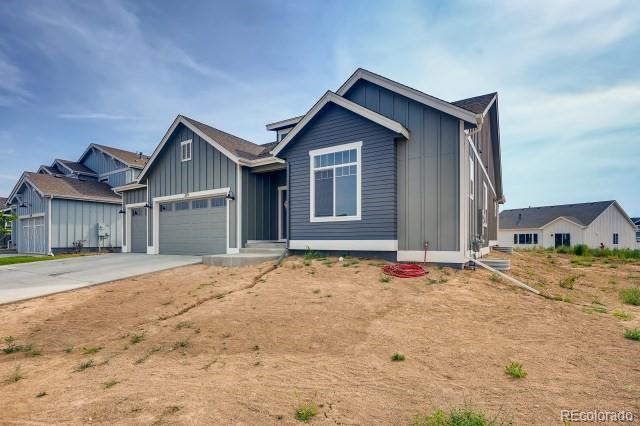 324 Spring Beauty Drive Berthoud, CO 80513 - Photo 2 of 25 a front view of a house with a yard