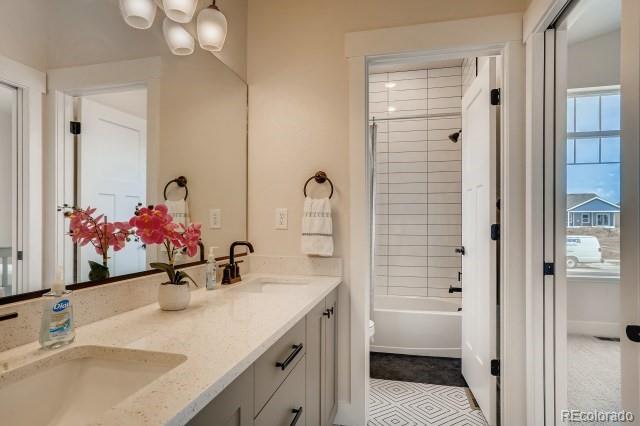 324 Spring Beauty Drive Berthoud, CO 80513 - Photo 23 of 25 a bathroom with a double vanity sink mirror and double