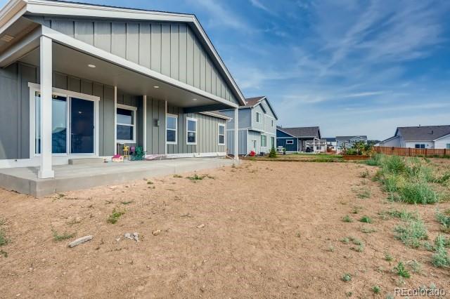 324 Spring Beauty Drive Berthoud, CO 80513 - Photo 24 of 25 a front view of a house with a yard