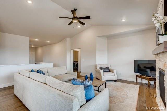 324 Spring Beauty Drive Berthoud, CO 80513 - Photo 5 of 25 a living room with furniture and a wooden floor