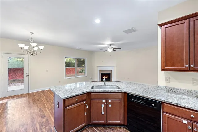 a kitchen with a sink and a stove top oven