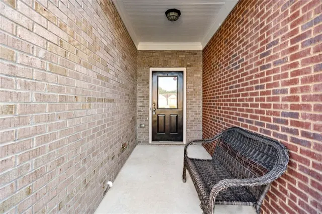 a balcony with wooden floor and a sink