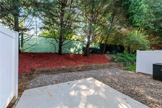 a view of backyard with green space