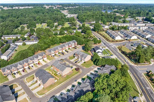 an aerial view of residential houses with outdoor space