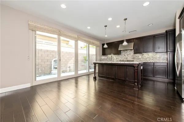 a view of kitchen with sink and wooden floor
