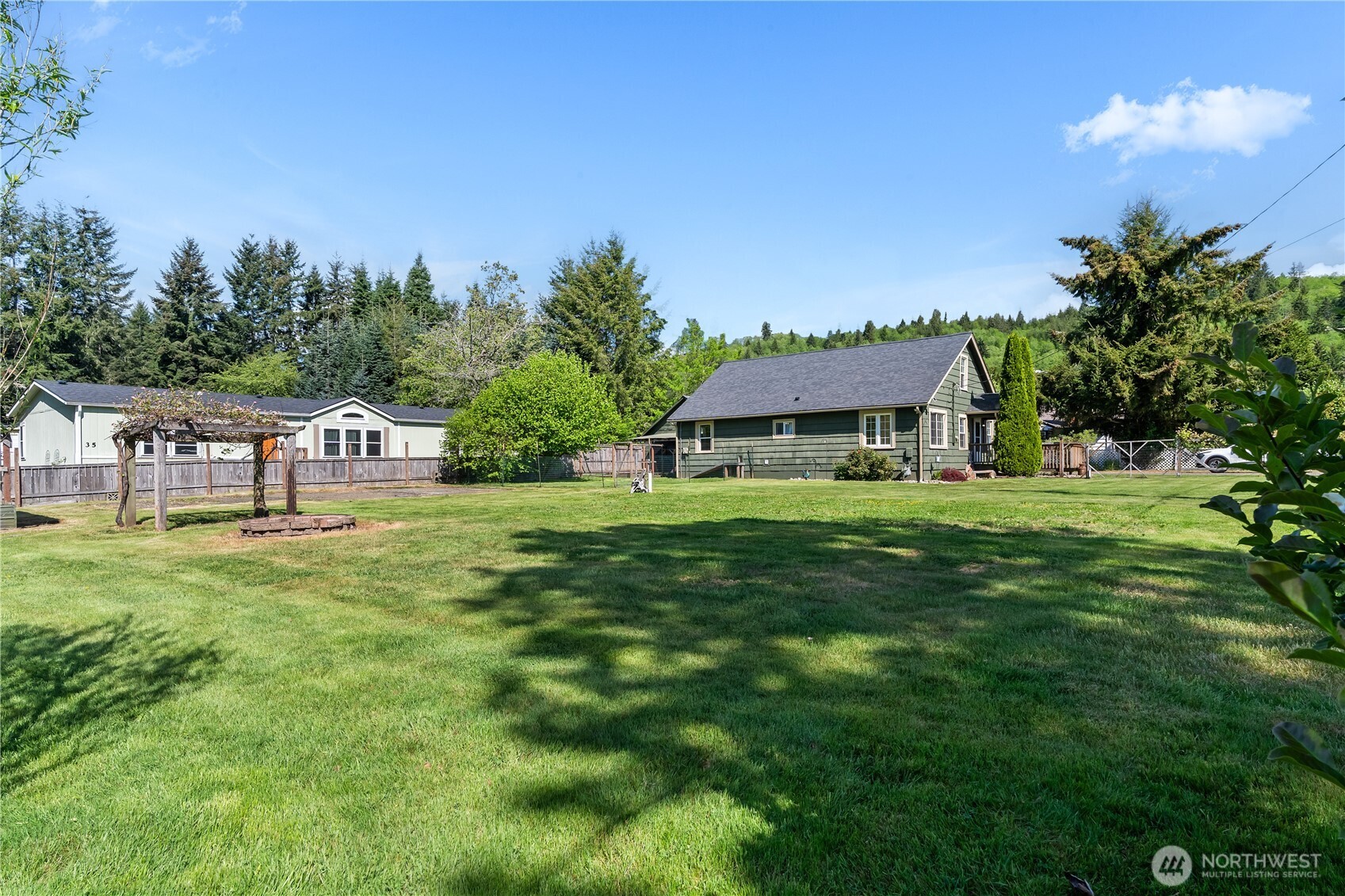 43 Camp Creek Road Montesano, WA 98563 - Photo 23 of 32 a front view of house with yard and trees in the background