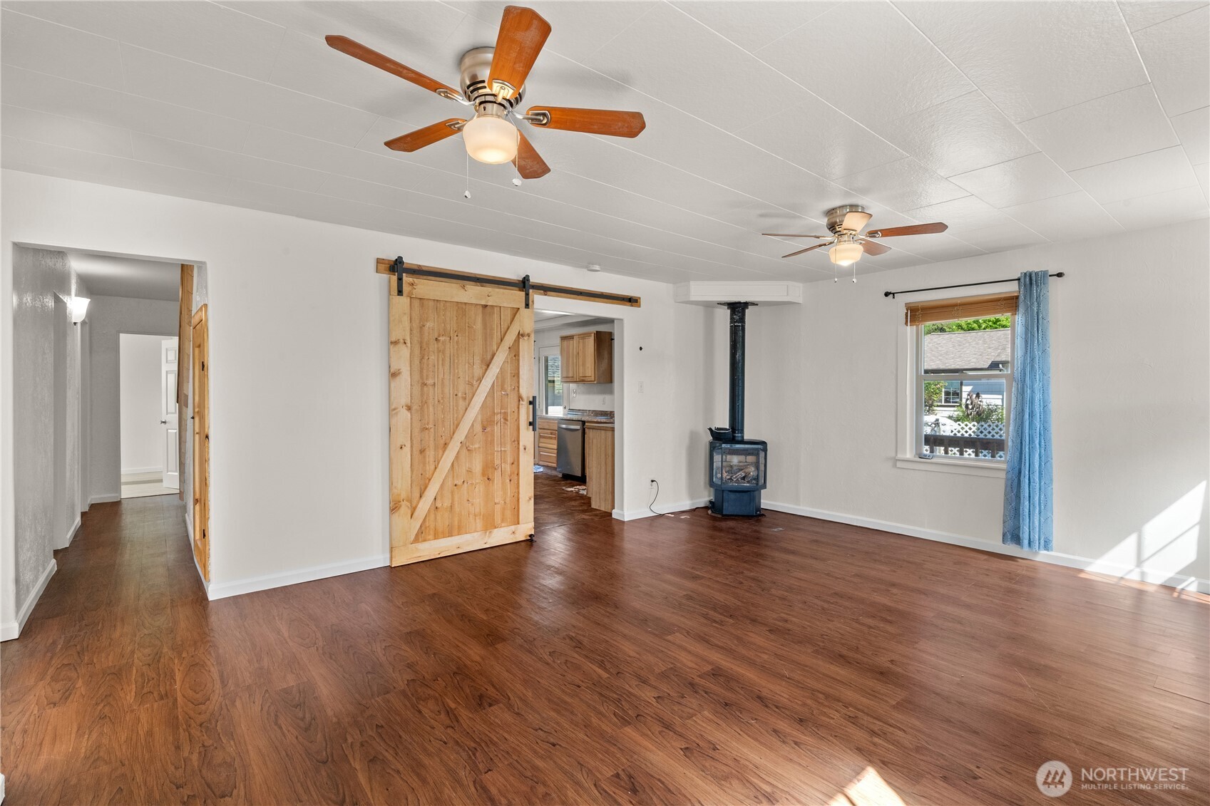 43 Camp Creek Road Montesano, WA 98563 - Photo 3 of 32 a view of an empty room with window and wooden floor