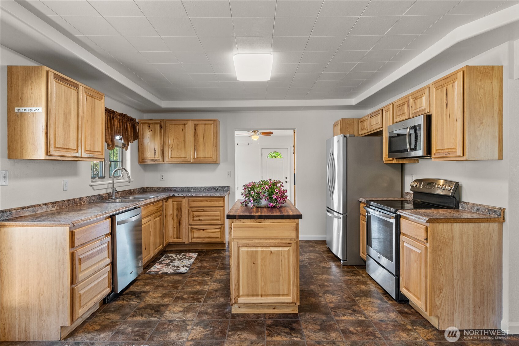 43 Camp Creek Road Montesano, WA 98563 - Photo 5 of 32 a kitchen with stainless steel appliances granite countertop a stove top oven a sink dishwasher a refrigerator and cabinets with wooden floor