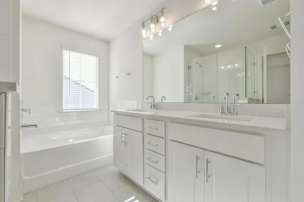 a bathroom with a bathtub and shower