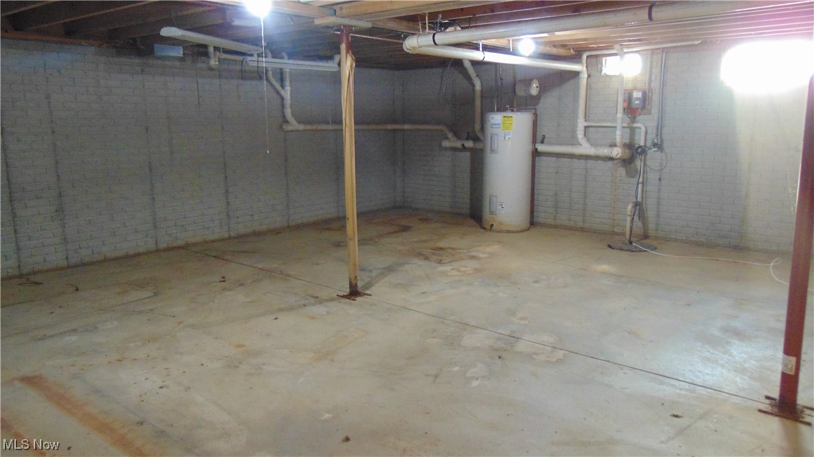 4970 Bryenton Road Litchfield, OH 44253 - Photo 30 of 33 Unfinished below grade area featuring electric water heater