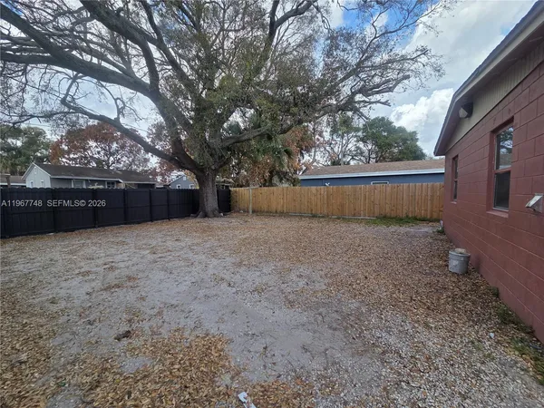 a view of backyard with green space