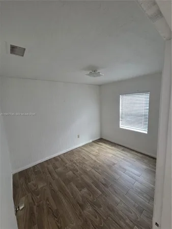 a view of an empty room and window