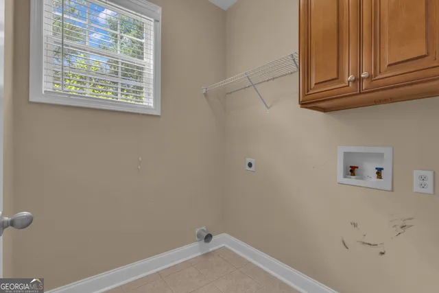 a kitchen with stainless steel appliances granite countertop wooden cabinets a stove a sink and dishwasher