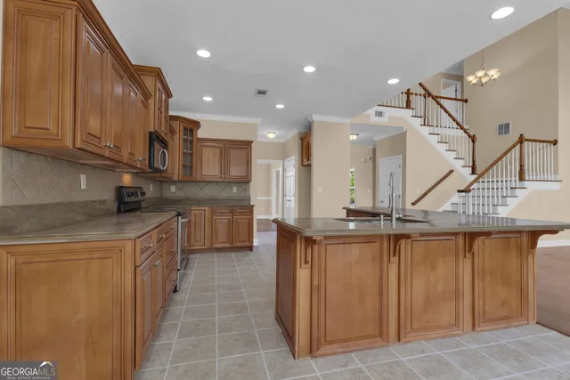 wooden floor fireplace and windows in an empty room