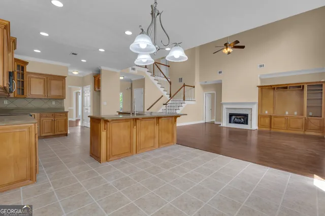 a bathroom with a toilet sink vanity and mirror