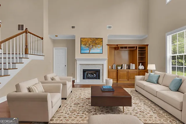 an empty room with a ceiling fan and a window