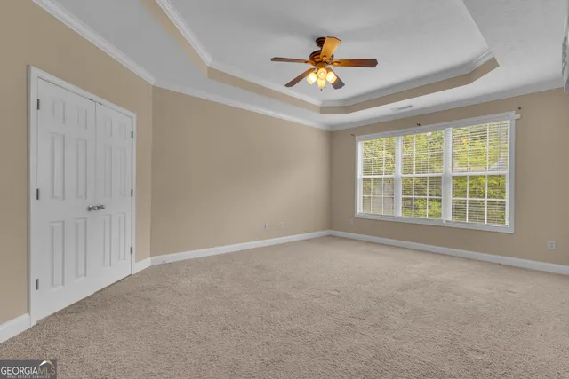 a spacious bathroom with a granite countertop sink and a mirror